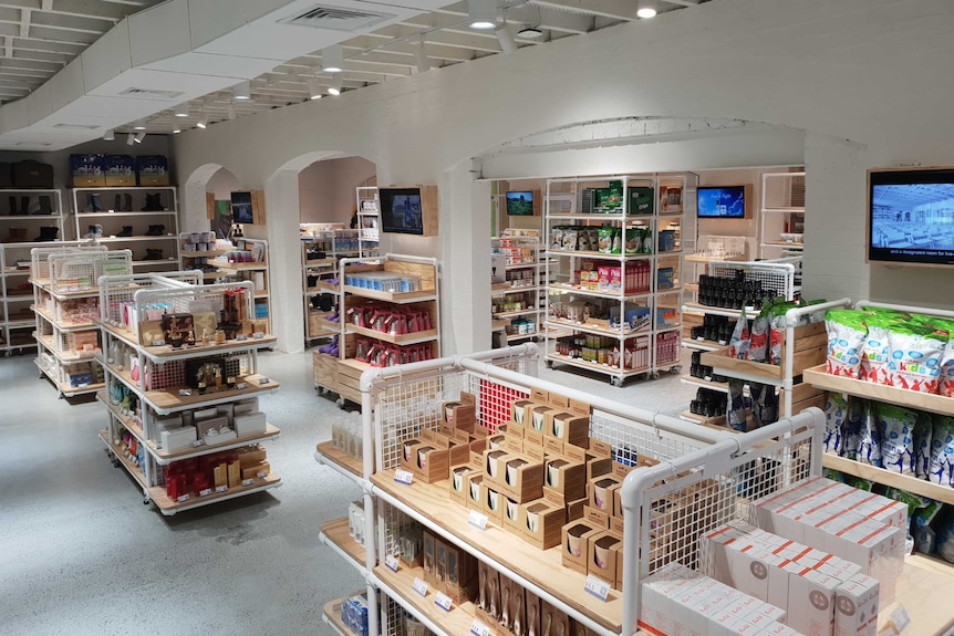 Inside an AuMake daigou store in Australia, with shelves packed with Australian goods.