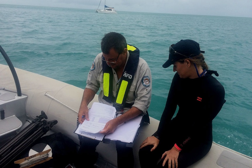 Senior Ranger Darren Lacombe on a boat.