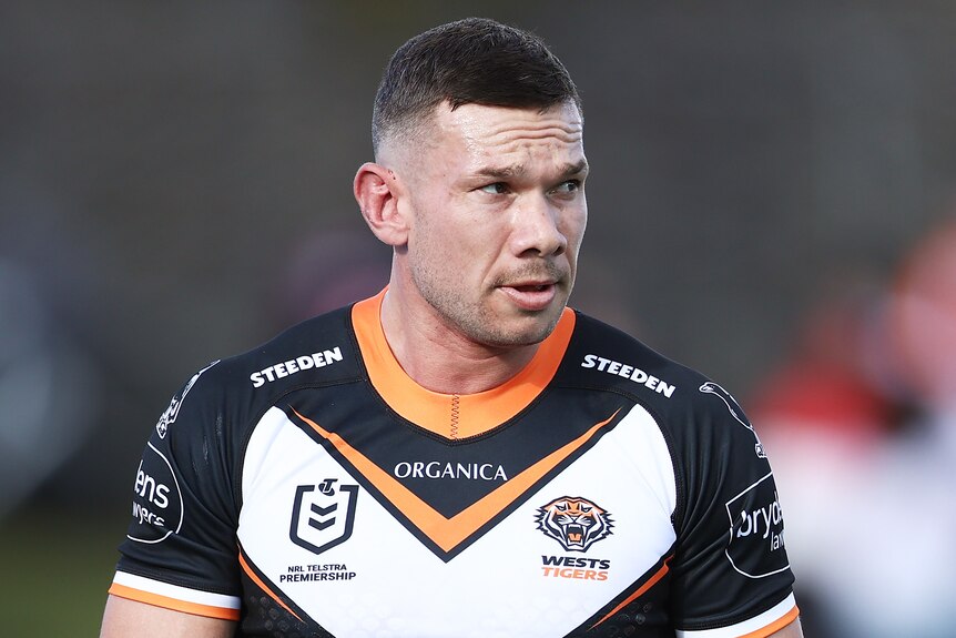 Brent Naden walks on the field wearing a Wests Tigers NRL jersey.
