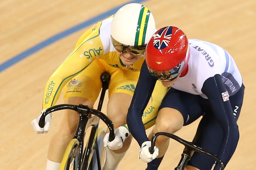 Anna Meares and Victoria Pendleton bump each other