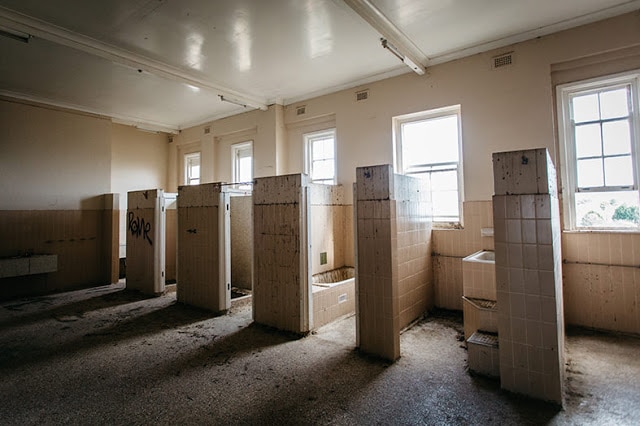 Row of bath tubs in an old rundown building