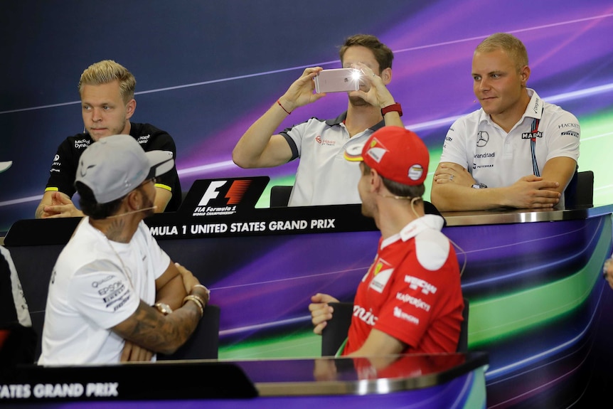Romain Grosjean takes photo of Lewis Hamilton (bottom left) ahead of the US F1 grand prix.