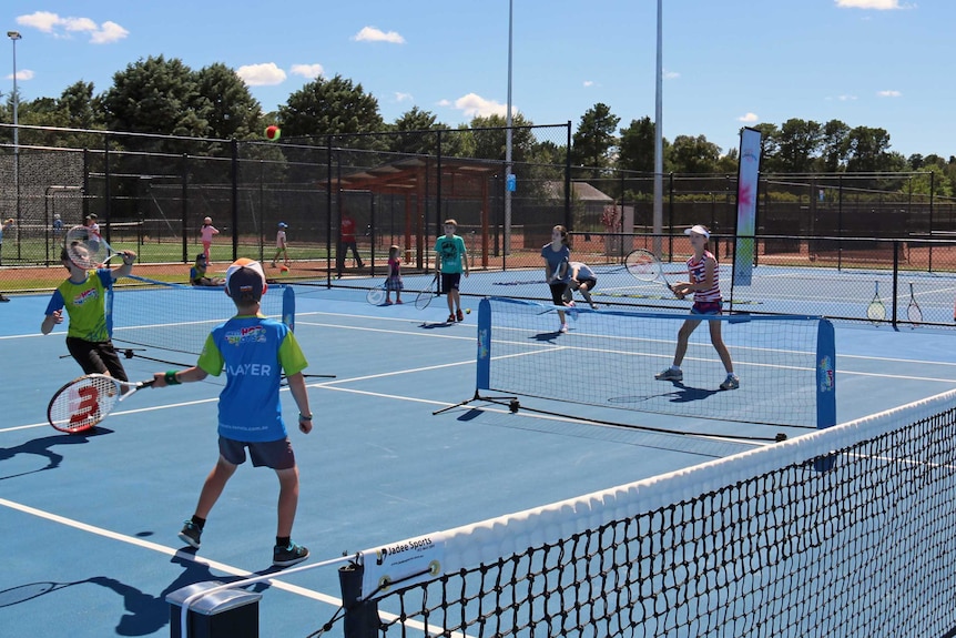 Dozens of children had the chance to try out tennis on the courts Nick Kyrgios grew up using.