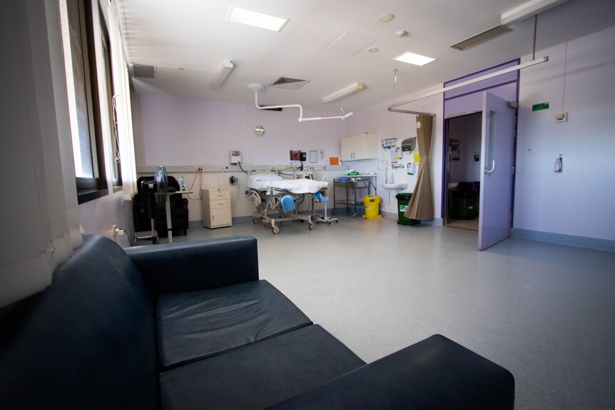 A clinical hospital room can be seen.