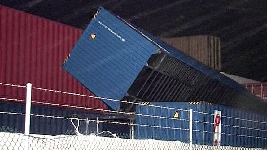 A freight container is blown onto its side after storm hits south-west Western Australia.