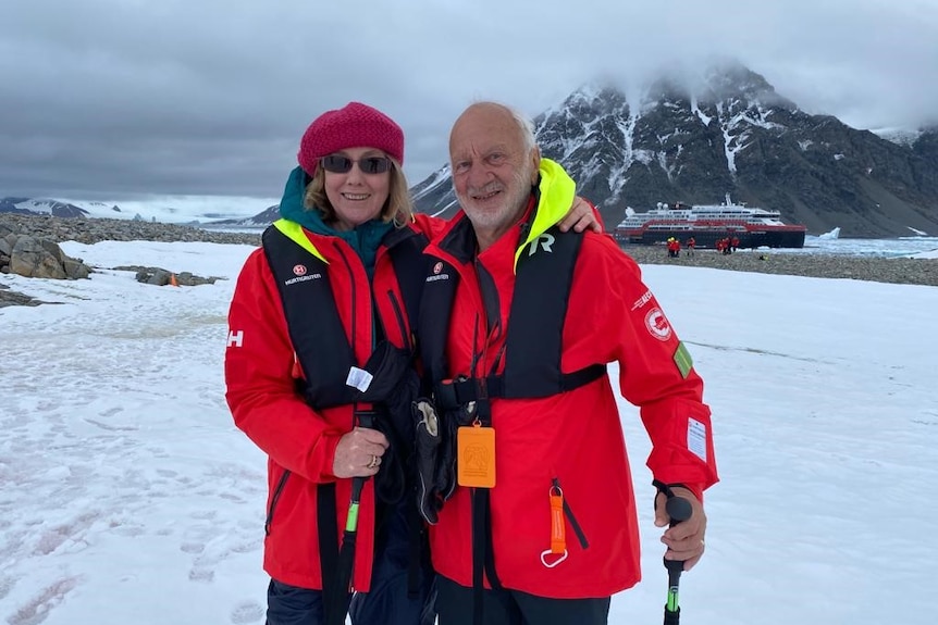 Jenny Cawson and Robert Rattray wear red jackets in Antarctica