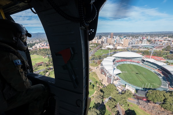 Black Hawk crew member looks over Adelaide Oval.