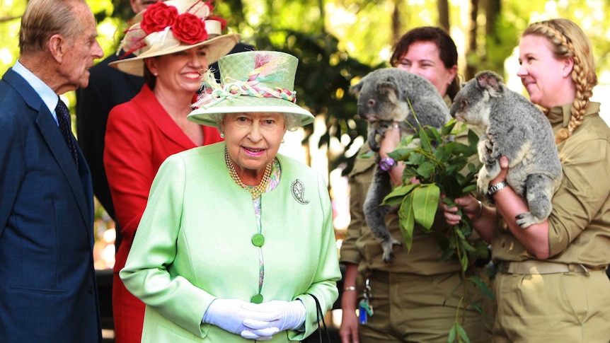 Queen Elizabeth II and the Duke of Edinburgh are greeted by two koalas during a trip to Brisbane.