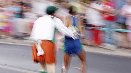 Vanderlei de Lima (right) is tackled by a spectator.