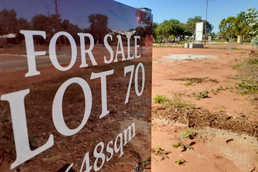 A For Sale sign sits on a vacant block of land in Broome 