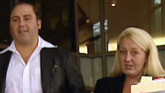 Tony Mokbel and Nicola Gobbo walk away from a Melbourne court.