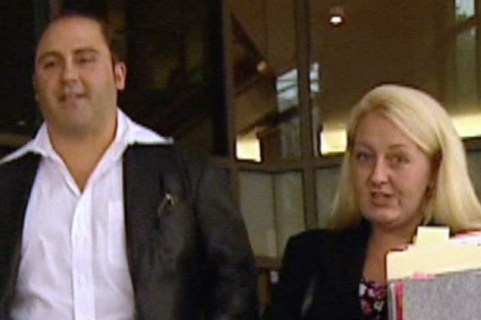 Tony Mokbel and Nicola Gobbo walk away from a Melbourne court.