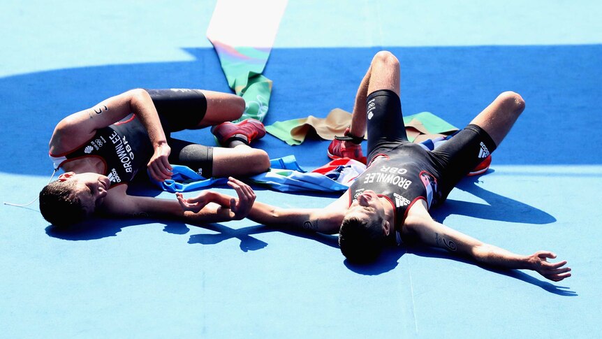 Alistair and Jonny Brownlee collapse to the floor after triathlon