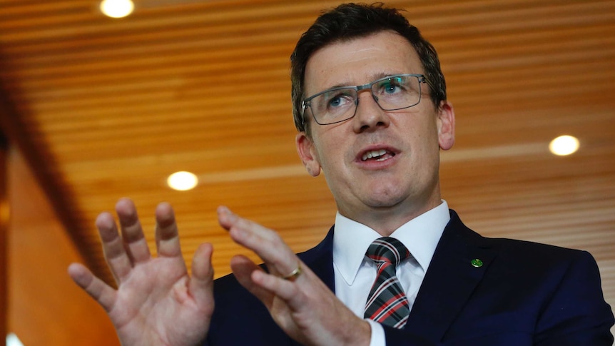 The Minister for Citie0,s Alan Tudge, stands in front of media in Canberra