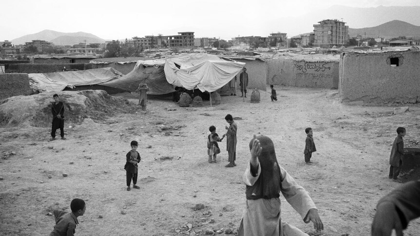 Children play in Charahi Qambar, one of the first camps for internally displaced Afghans that developed after 2001.