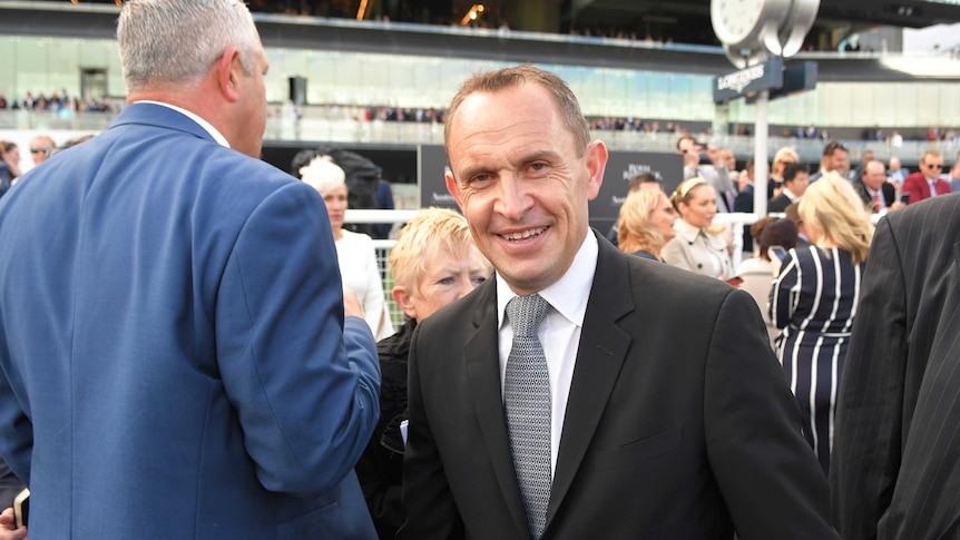 Trainer Chris Waller is seen after Winx rides to victory in the 2018 Winx Stakes at Flemington.