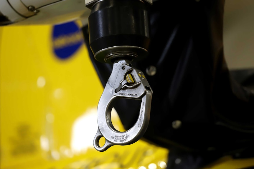 A hook at the end of a hoist cable of an RACQ CQ Rescue Helicopter aircraft.