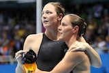 Australian swimmers Cate and Bronte Campbell hug after getting out of the pool.