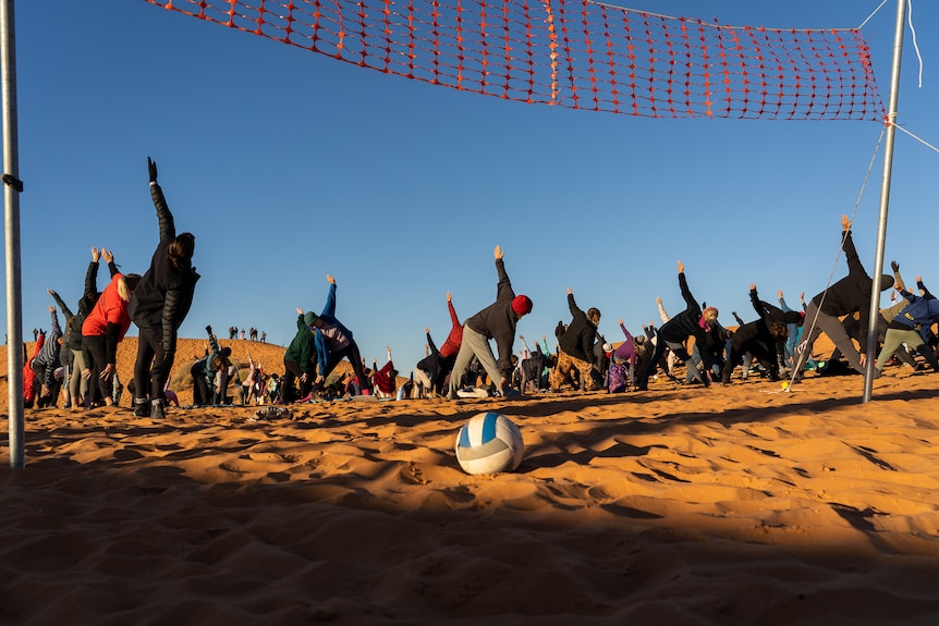 Festival-goers bend and stretch their way at the beginning of another Big Red Bash day