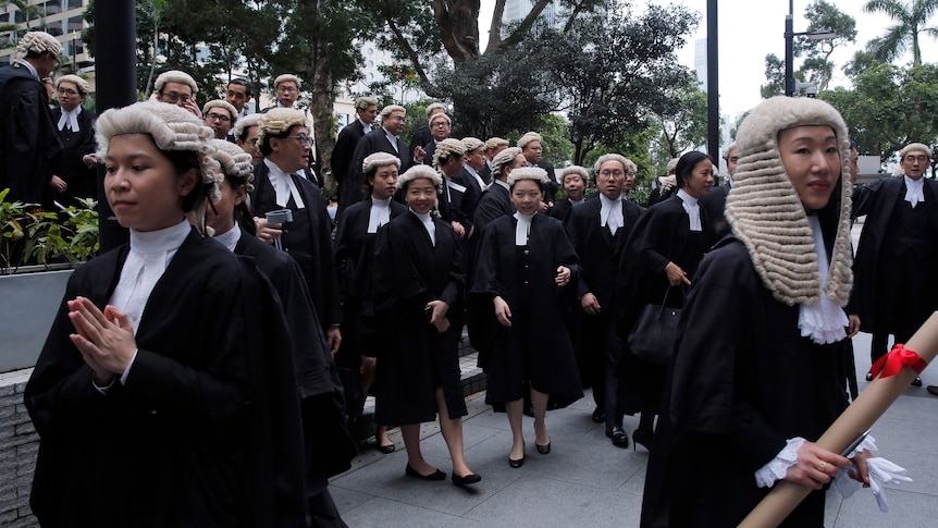 Barristers walk after an appointment ceremony for senior counsel outside the Court of Final Appeal.