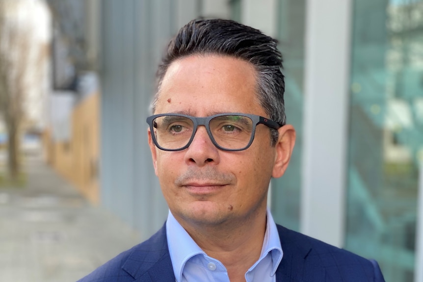 Man wearing glasses standing outside