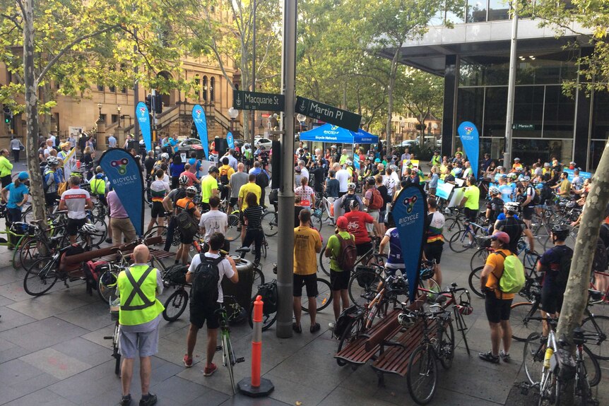 About 200 cyclists gather in Martin Place across from NSW Parliament House to protest against new cycling laws,