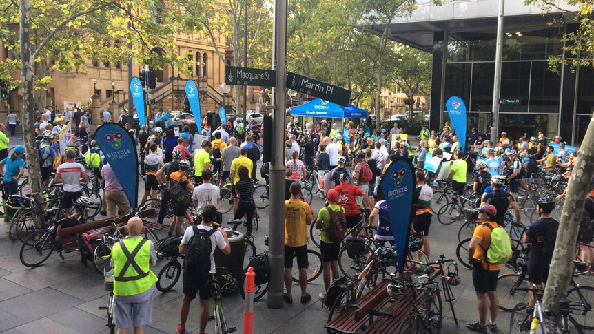 About 200 cyclists gather in Martin Place across from NSW Parliament House to protest against new cycling laws,