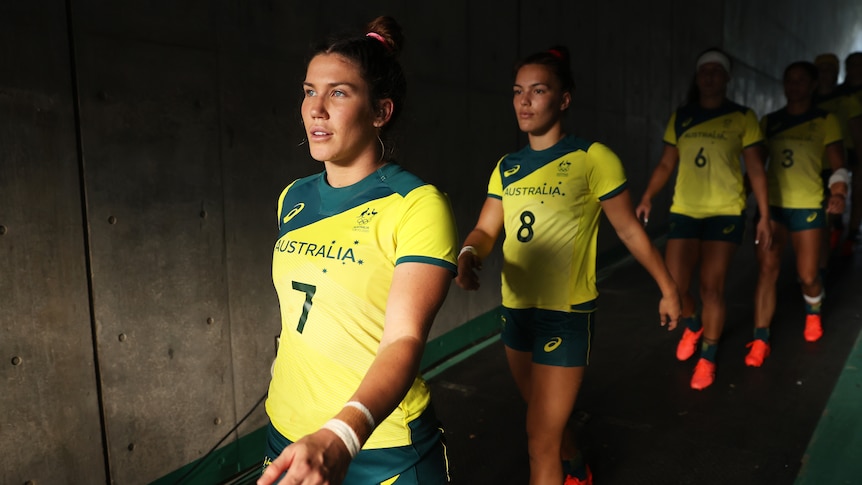 Australian sevens player Charlotte Caslick leads the team out at the Tokyo Olympics