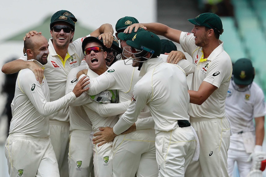 David Warner and Australia share in the celebrations after the dismissal of AB de Villiers.