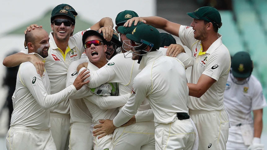 David Warner and Australia share in the celebrations after the dismissal of AB de Villiers.