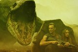 Brie Larson and Tom Hiddleston hide from a monster in Kong: Skull Island.