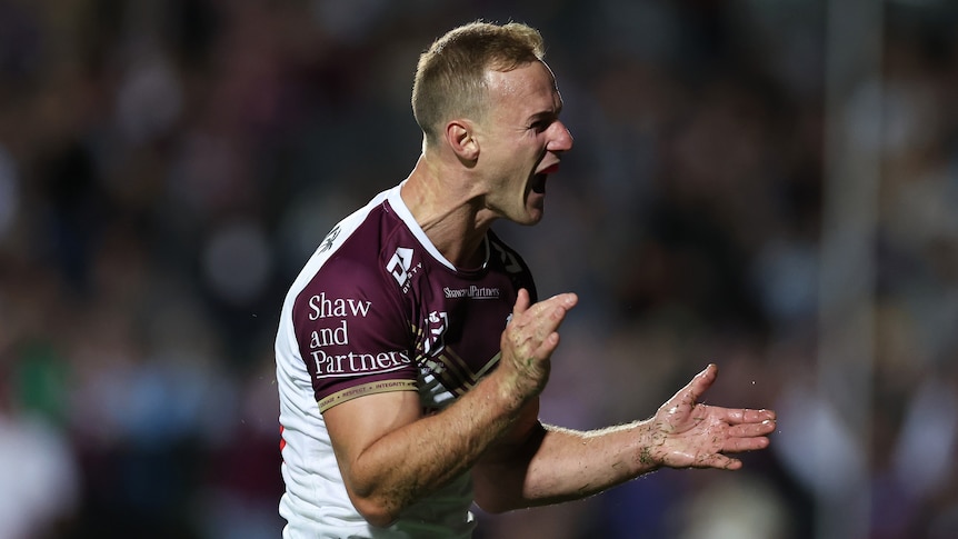 NRL player Daly Cherry-Evans clapping his hands during a night match against Parramatta