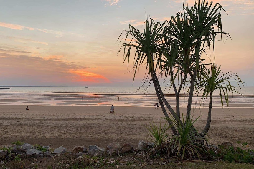 The sun setting at Mindil Beach in Darwin, 2019.