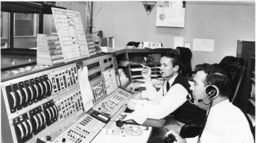 John Saxon and Mike Dinn at the Ops console at Honeysuckle Creek.