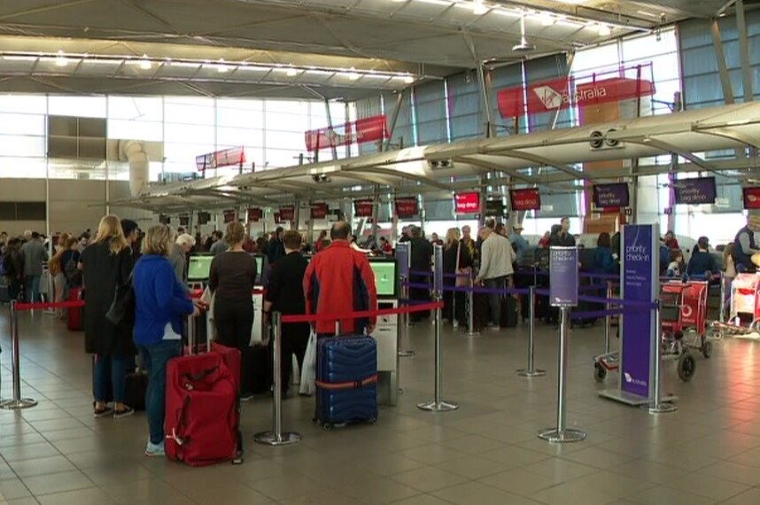 customers waiting in line at an airport