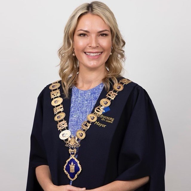 Sarah carter wearing mayoral robes.