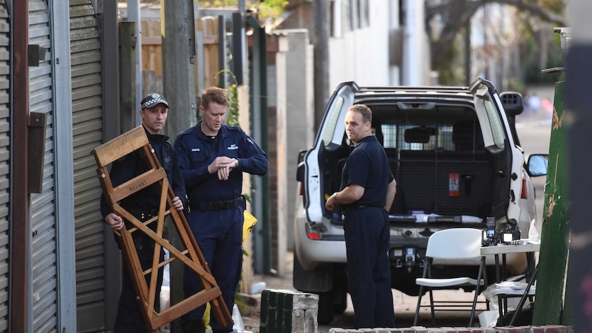 Police at a crime scene after four men were arrested in counter-terror raids across Sydney.