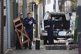 Police at a crime scene after four men were arrested in counter-terror raids across Sydney.