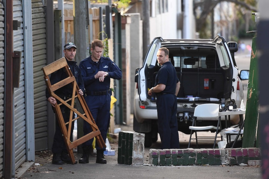 Police at a crime scene after four men were arrested in counter-terror raids across Sydney.