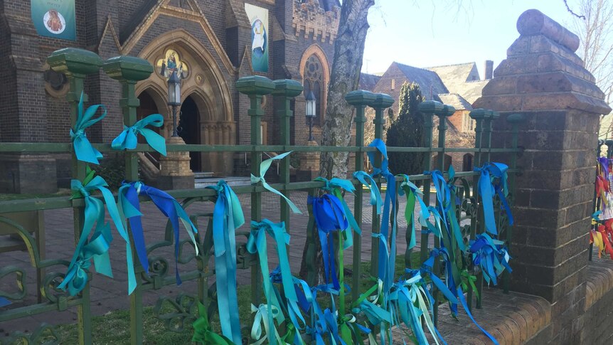 Blue ribbons tied to the fence of the Armidale Catholic Cathedral. Sept, 2016.