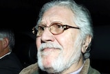 Former BBC presenter Dave Lee Travis returns to his house in Mentmore, southern England after being interviewed by police.