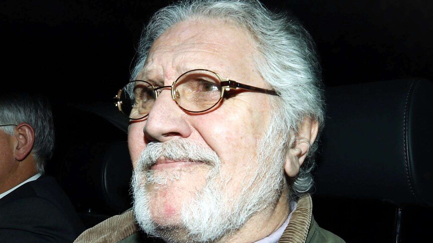 Former BBC presenter Dave Lee Travis returns to his house in Mentmore, southern England after being interviewed by police.