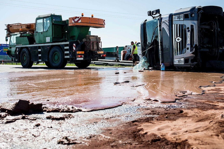 Tons of liquid milk chocolate are spilled and block six lanes on a highway