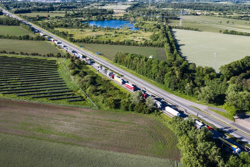 Cars and trucks queue on highway E45 after Denmark reopened its borders to Germany.