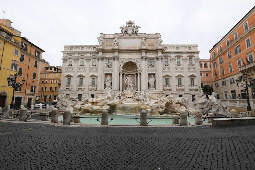 The area surrounding Italy's famous Trevi Fountain lies bare.