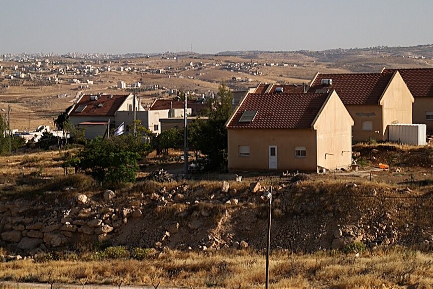 Homes in the village of Tuba and the Israeli settlement of Ma'on.