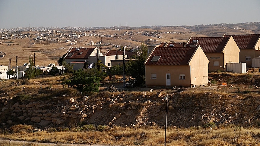 Homes in the village of Tuba and the Israeli settlement of Ma'on.