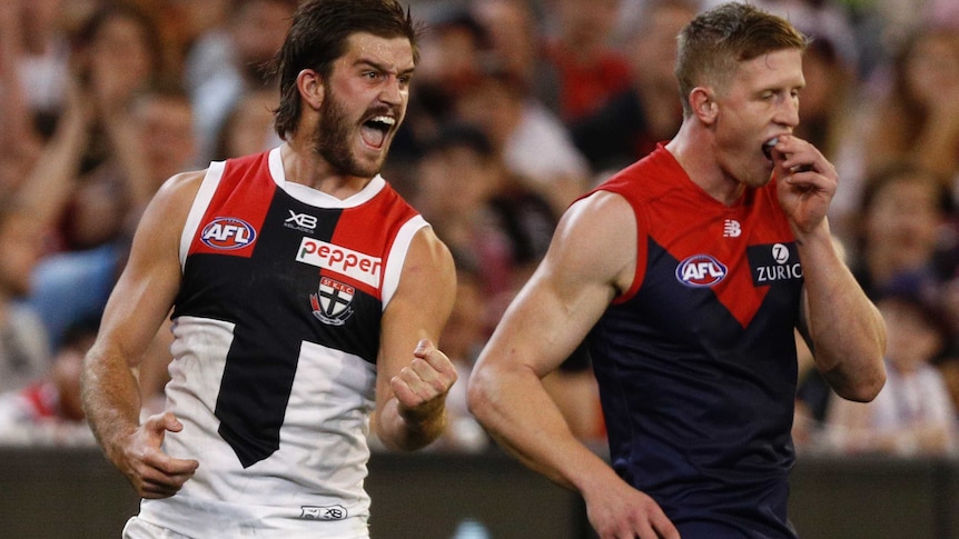 Josh Bruce pumps his fist and screams with delight as a deflated Sam Frost removes his mouthguard.