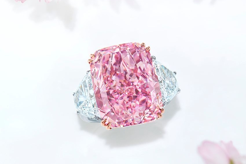 A ring featuring a massive rectangular pink diamond. 