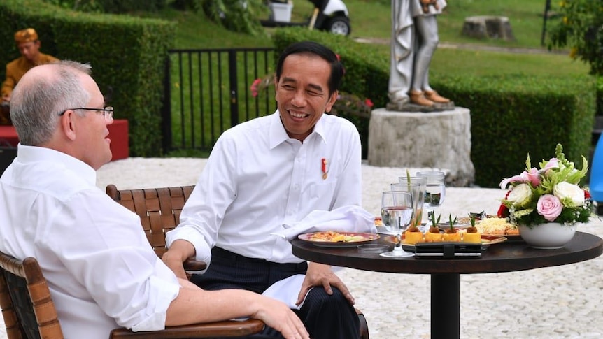 Prime Minister Scott Morrison sits with Indonesian President Joko Widodo.